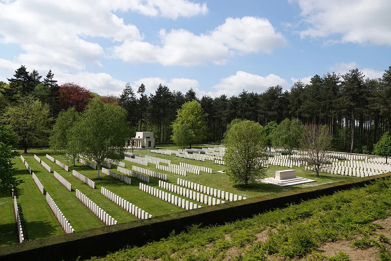 Rows of headstones among the trees of Buttes New British Cemetery, Polygon Wood, Zonnebeke.