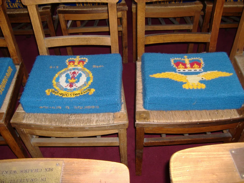 Embroidered regimental kneelers in St George's Memorial Church, Ypres.