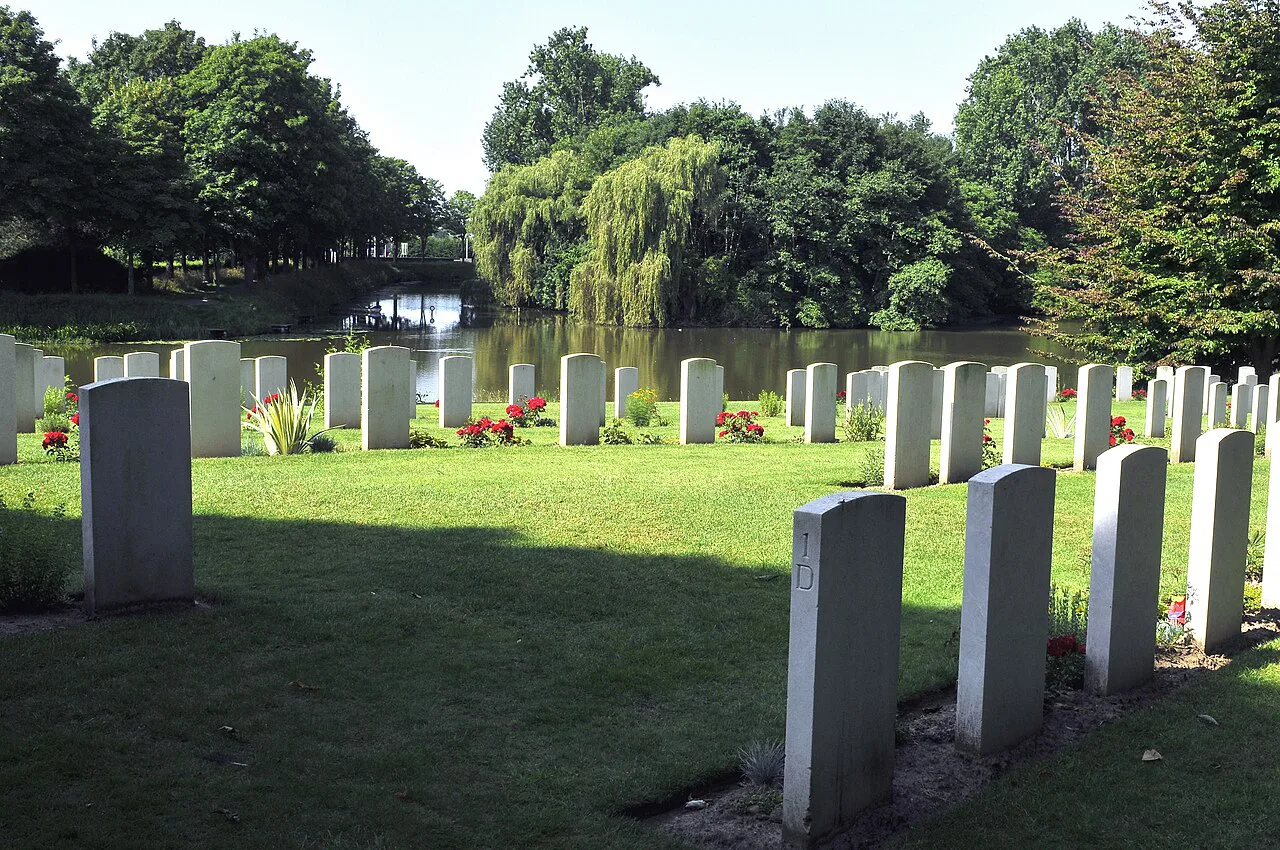 Headstones beside the moat at Ramparts Cemetery, Ypres.